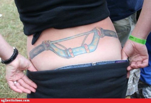 Tags: Cycling, tattoos, tramp stamp. At least it beats the tribal tramp 